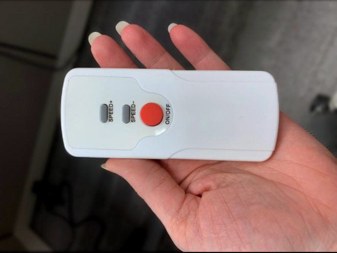 A remote shown in a hand