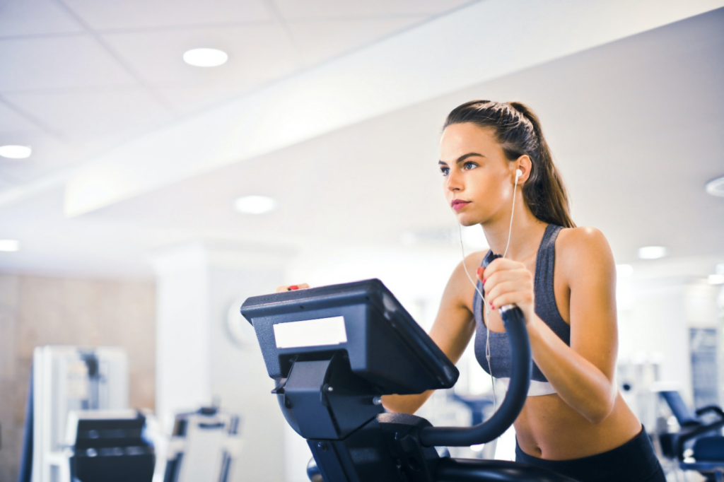A woman is seen exercising on a treadmill