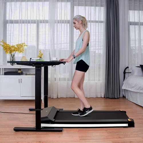 A woman working on UMAY Under Desk Treadmill